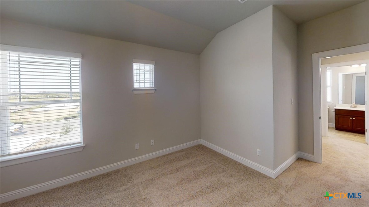 116 Hidden Branch Cove Maxwell, TX 78656 - Photo 22 of 23 an empty room with windows