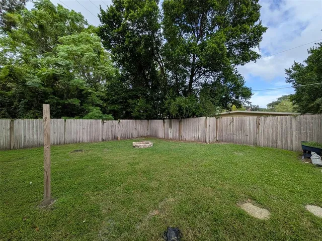 a backyard of a house and trees