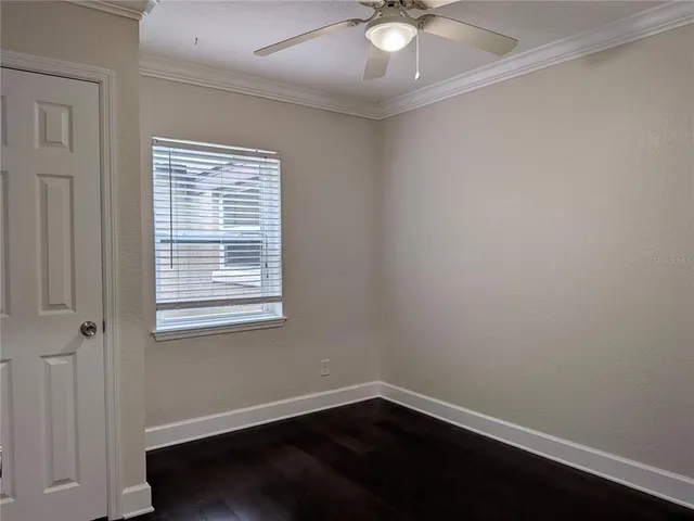 an empty room with wooden floor