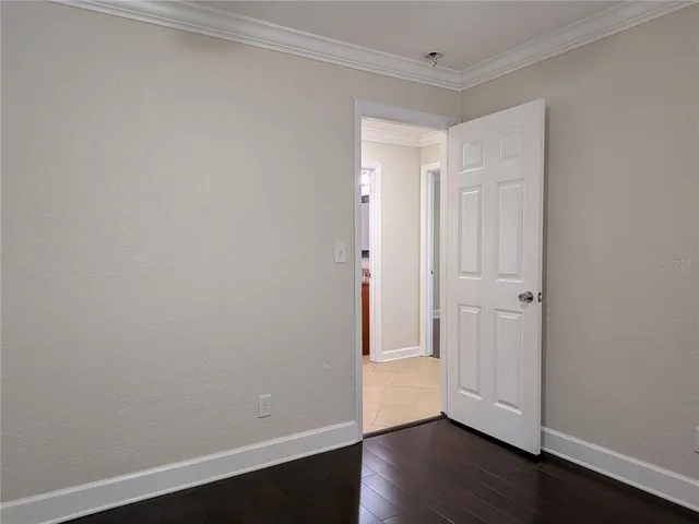a bathroom with a granite countertop sink toilet and a mirror
