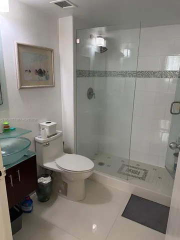a bathroom with a sink vanity and a mirror