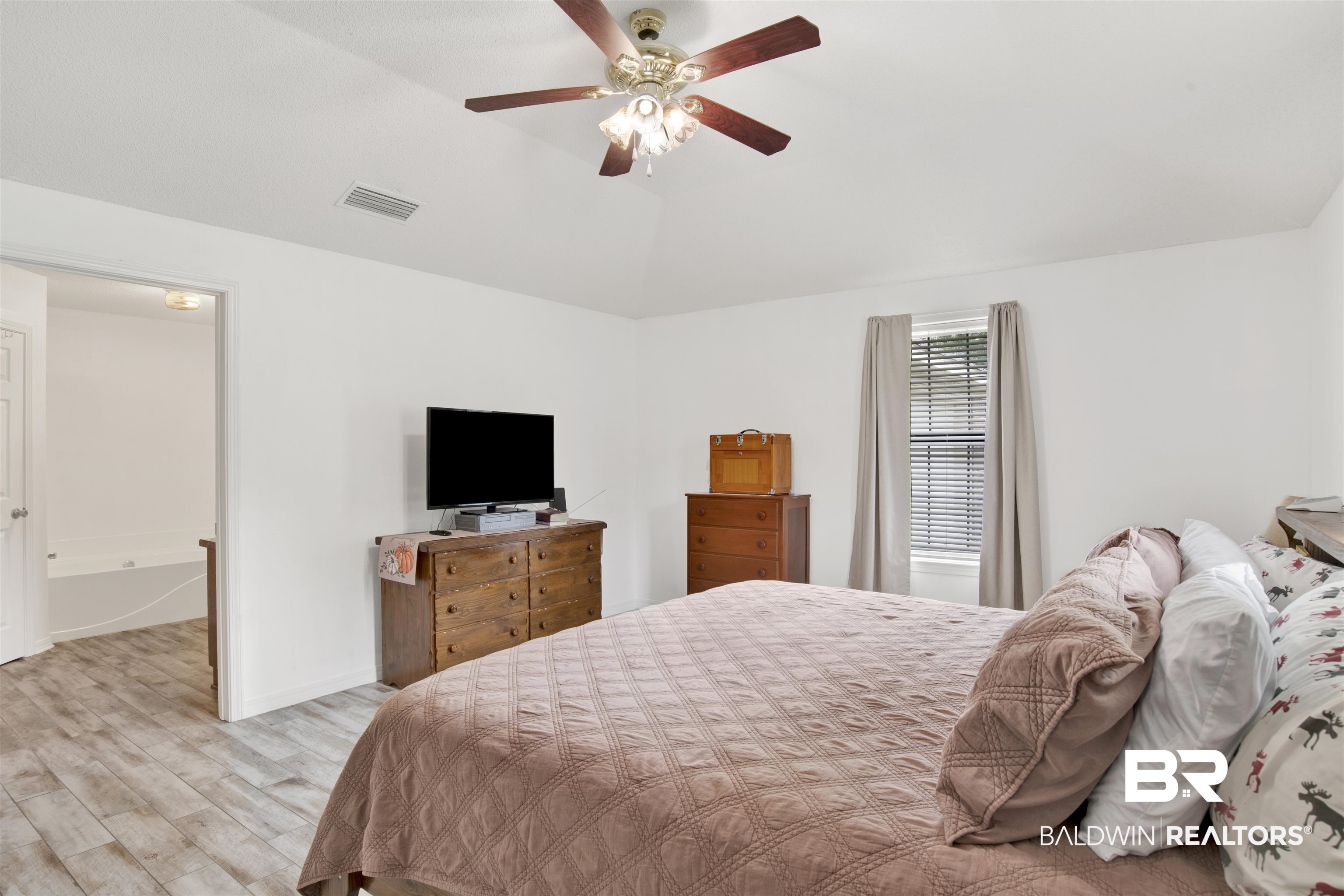 54563 Splinter Hill Road Perdido, AL 36562 - Photo 20 of 29 Bedroom featuring lofted ceiling, ceiling fan, and light hardwood / wood-style floors