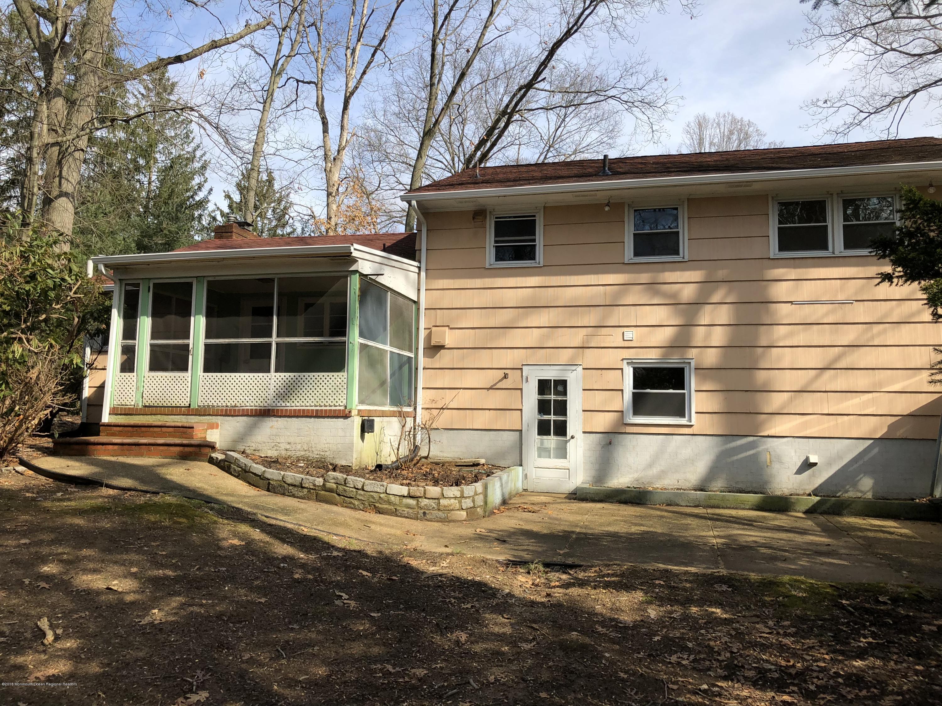 148 Wemrock Road Freehold, NJ 07728 - Photo 6 of 23 a view of a house with a yard