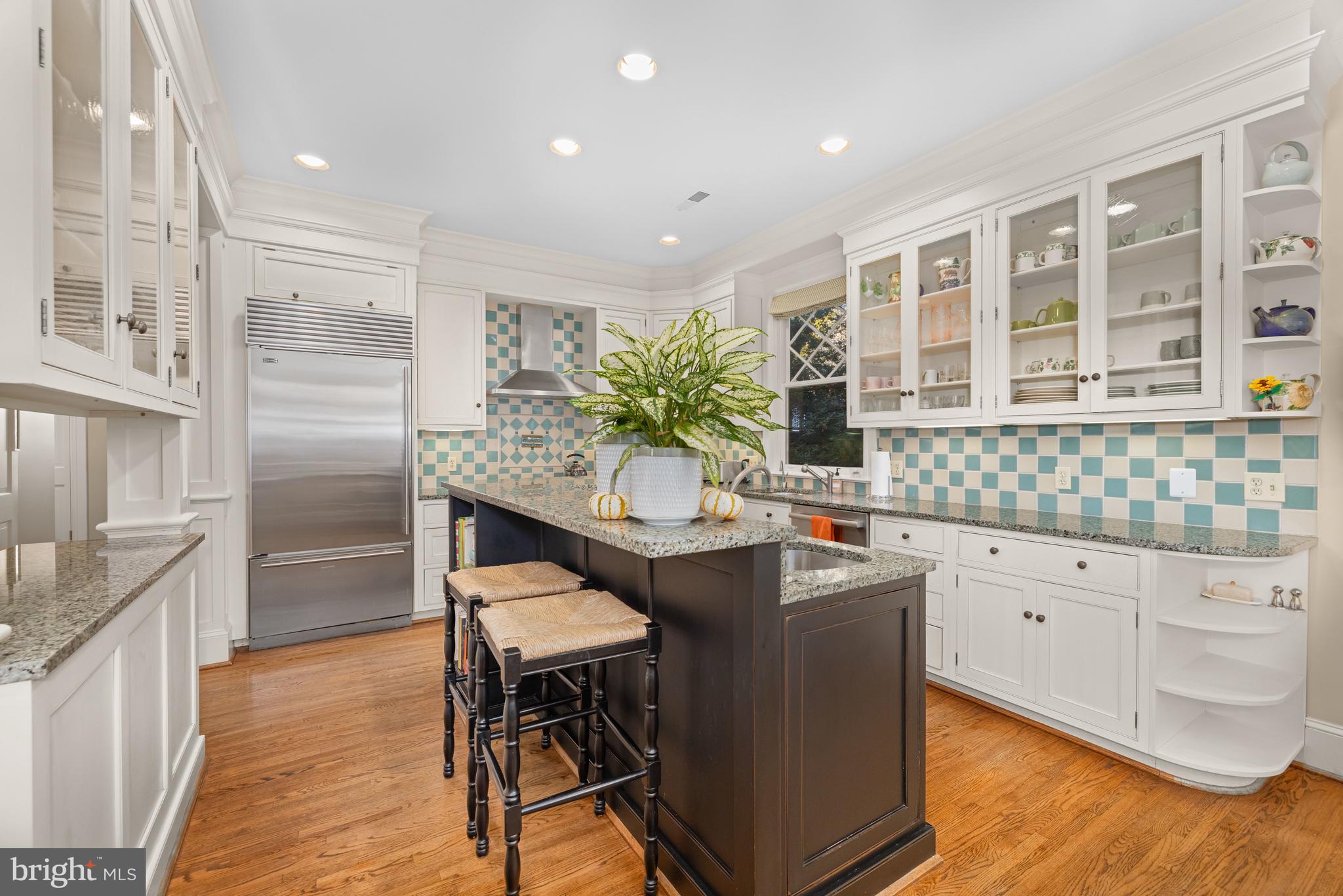 2955 Newark Street Northwest Washington, DC 20008 - Photo 12 of 47 a kitchen with stainless steel appliances granite countertop a table chairs stove a sink and dishwasher