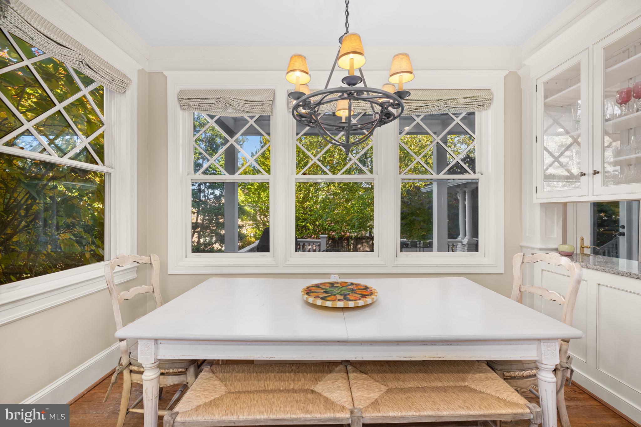 2955 Newark Street Northwest Washington, DC 20008 - Photo 13 of 47 a view of a dining room with a window and chandelier