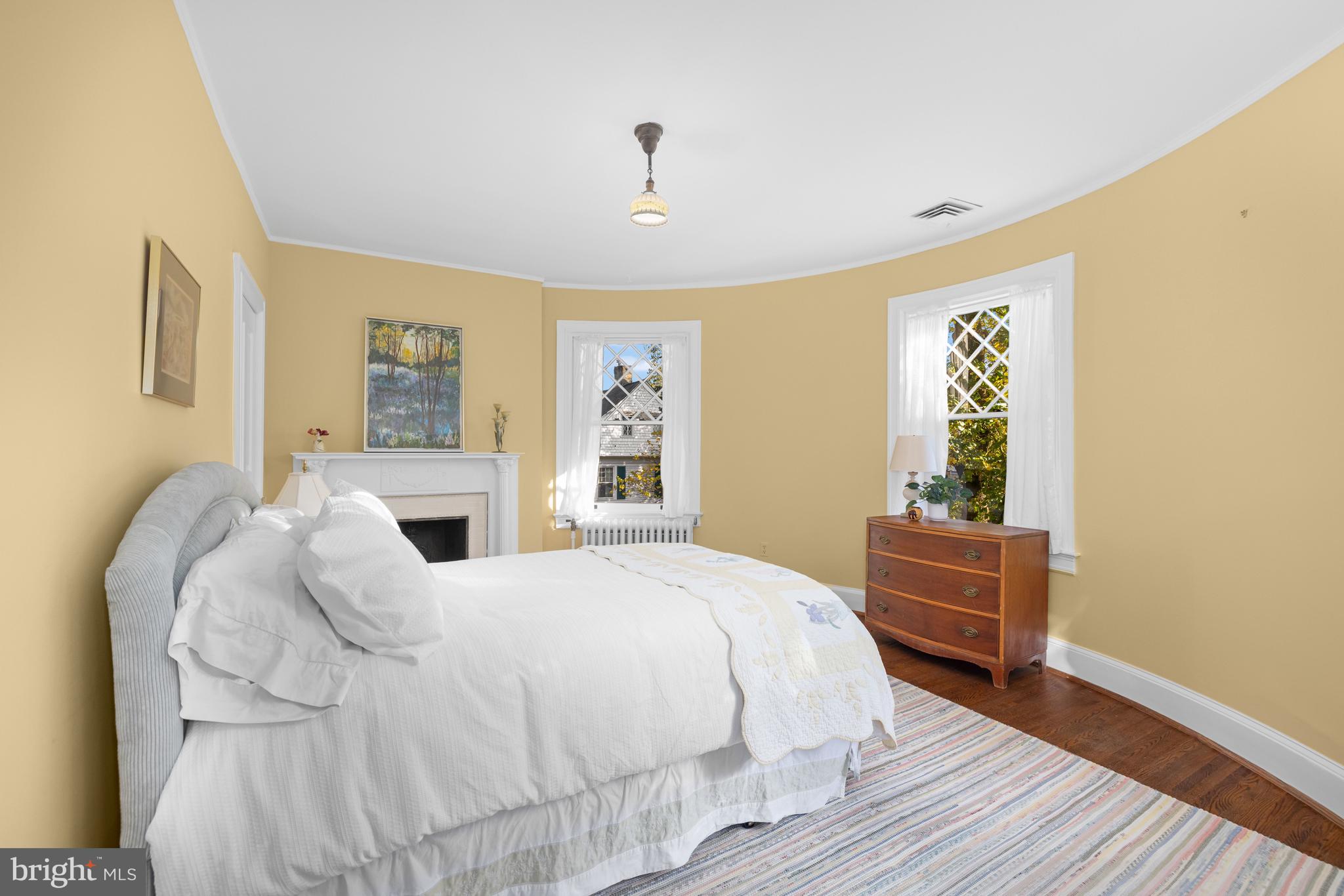 2955 Newark Street Northwest Washington, DC 20008 - Photo 28 of 47 a spacious bedroom with a bed and a dresser