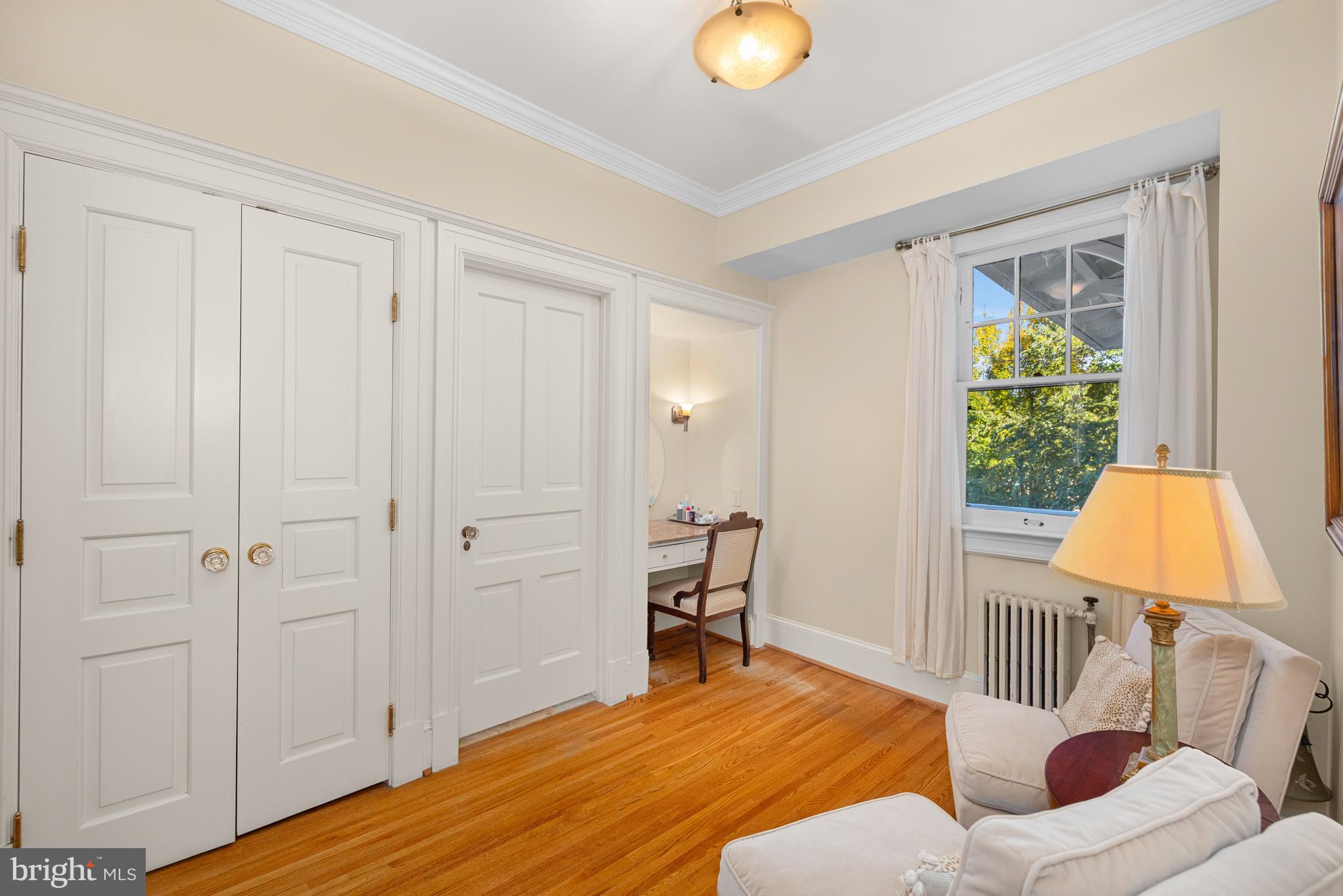 2955 Newark Street Northwest Washington, DC 20008 - Photo 33 of 47 a bedroom with a bed and a window