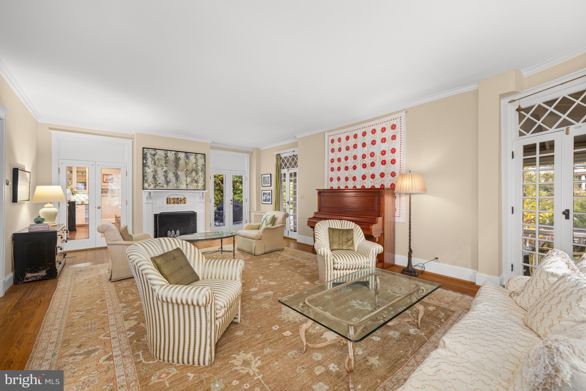 2955 Newark Street Northwest Washington, DC 20008 - Photo 4 of 47 a living room with furniture a fireplace and a table