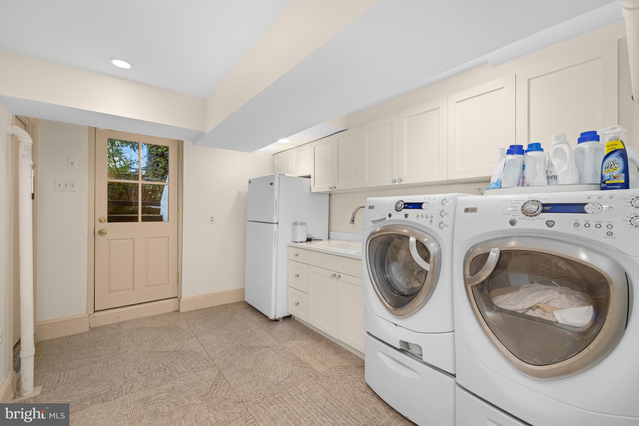 2955 Newark Street Northwest Washington, DC 20008 - Photo 43 of 47 a utility room with sink dryer and washer