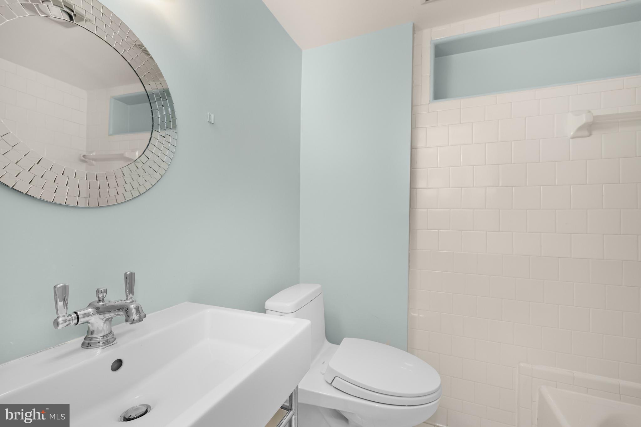 2955 Newark Street Northwest Washington, DC 20008 - Photo 44 of 47 a bathroom with a sink and a mirror