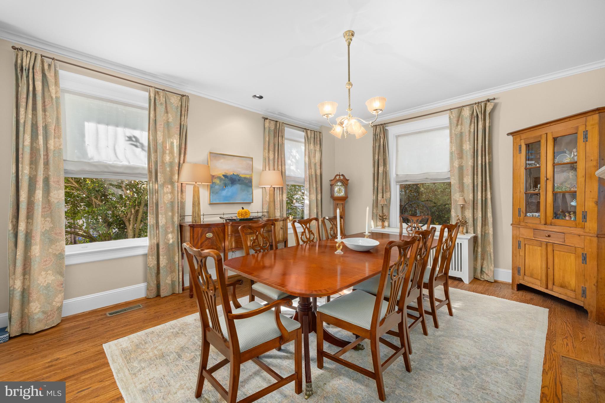 2955 Newark Street Northwest Washington, DC 20008 - Photo 8 of 47 a dining room with furniture a chandelier and wooden floor