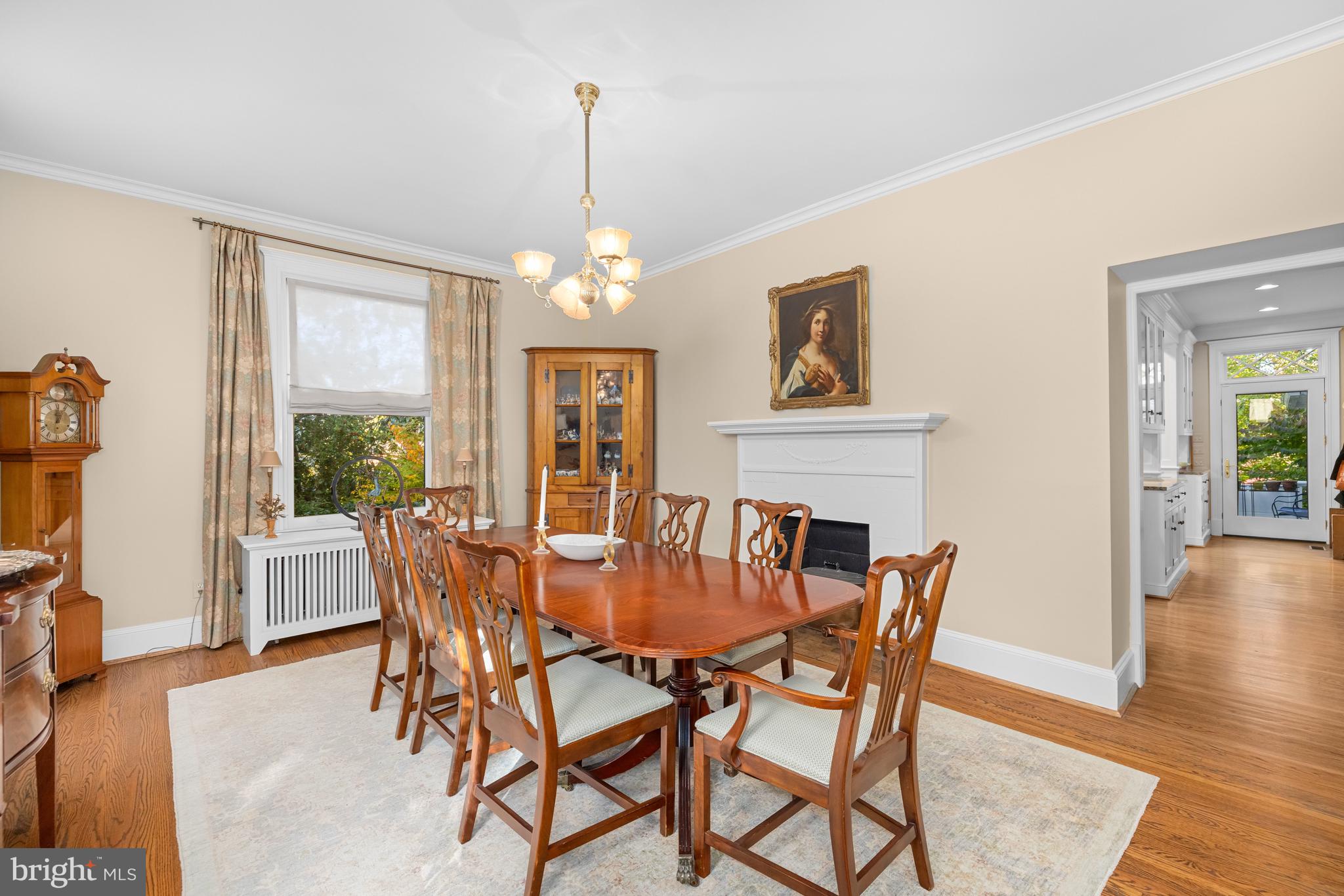 2955 Newark Street Northwest Washington, DC 20008 - Photo 9 of 47 a dining room with furniture a chandelier and wooden floor