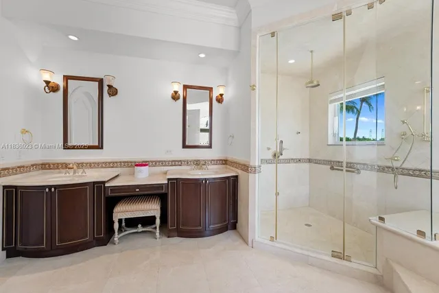 a bathroom with a tub sink shower and mirror