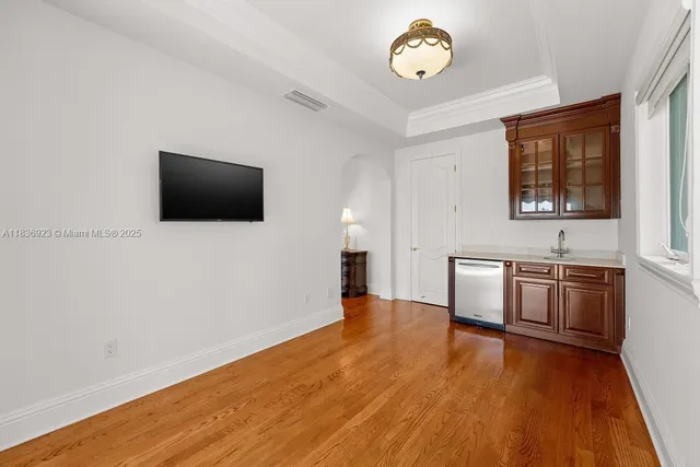 a view of a livingroom with a kitchen