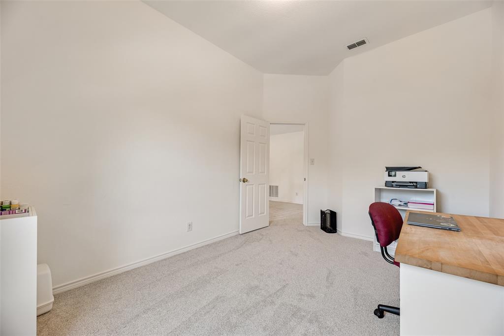 1406 West Peters Colony Road Carrollton, TX 75007 - Photo 27 of 29 a bedroom with furniture and closet