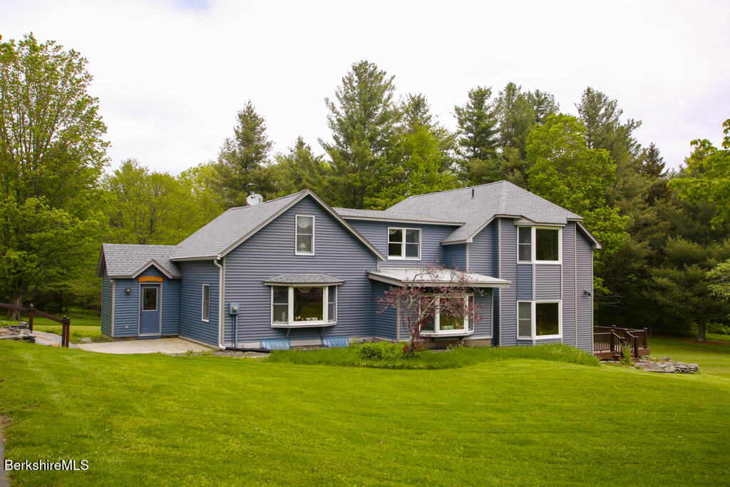 1271 Main Road Savoy, MA 01256 - Photo 1 of 38 a front view of a house with a garden