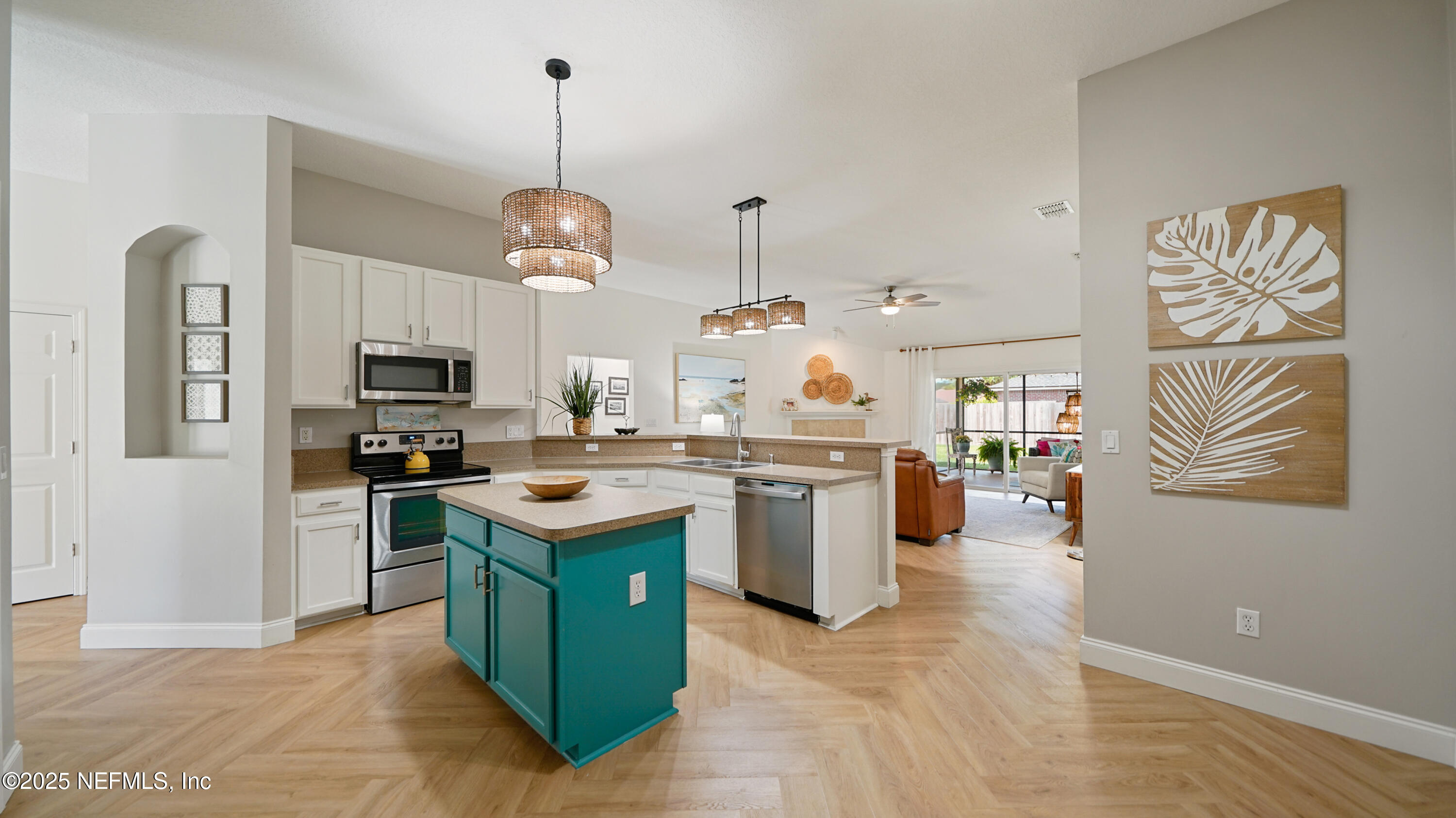 2020 Spring Meadows Court St. Augustine, FL 32092 - Photo 11 of 45 a kitchen with kitchen island granite countertop stainless steel appliances stove a sink and a refrigerator