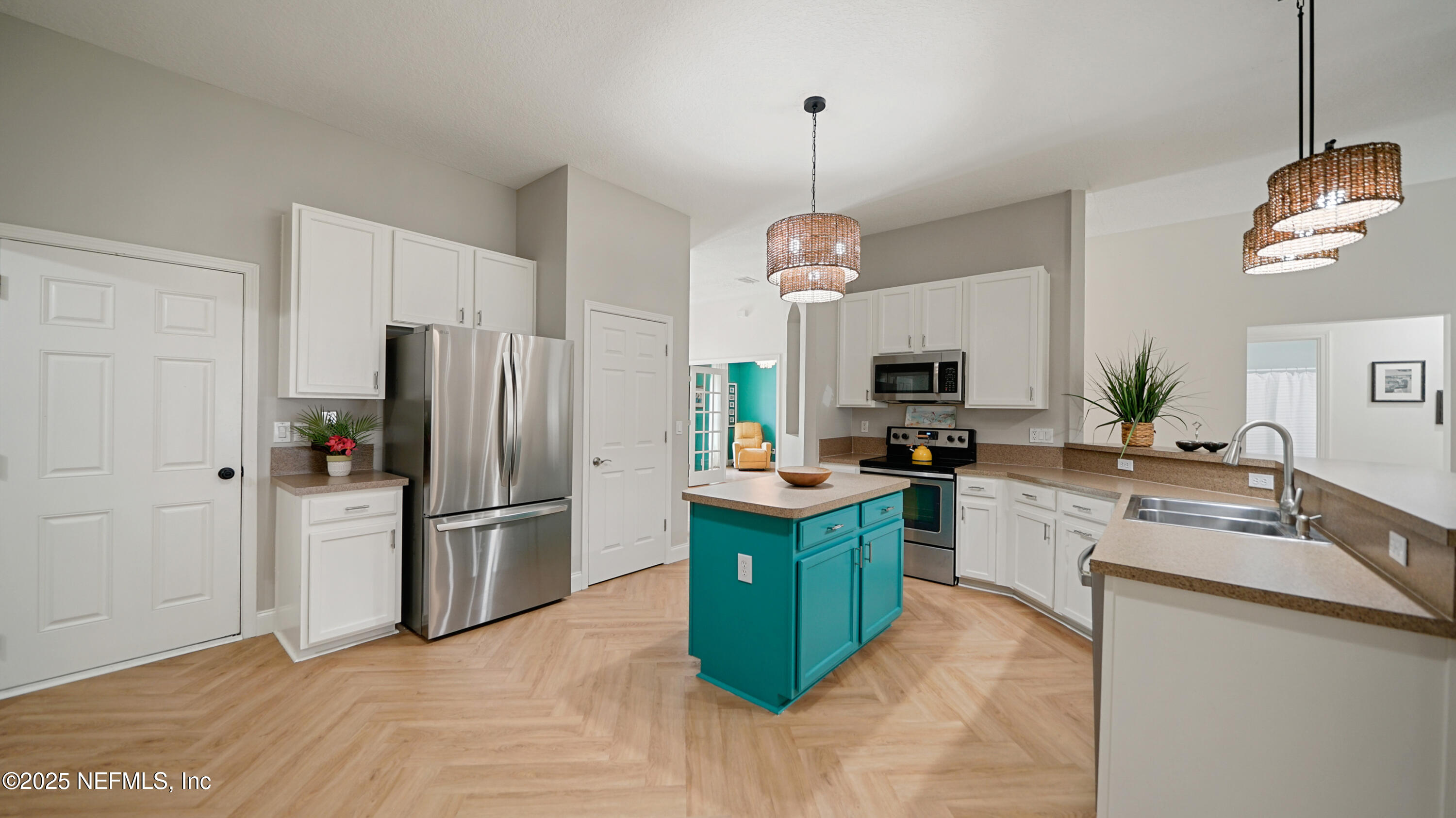 2020 Spring Meadows Court St. Augustine, FL 32092 - Photo 12 of 45 a kitchen with granite countertop stainless steel appliances a refrigerator microwave and sink