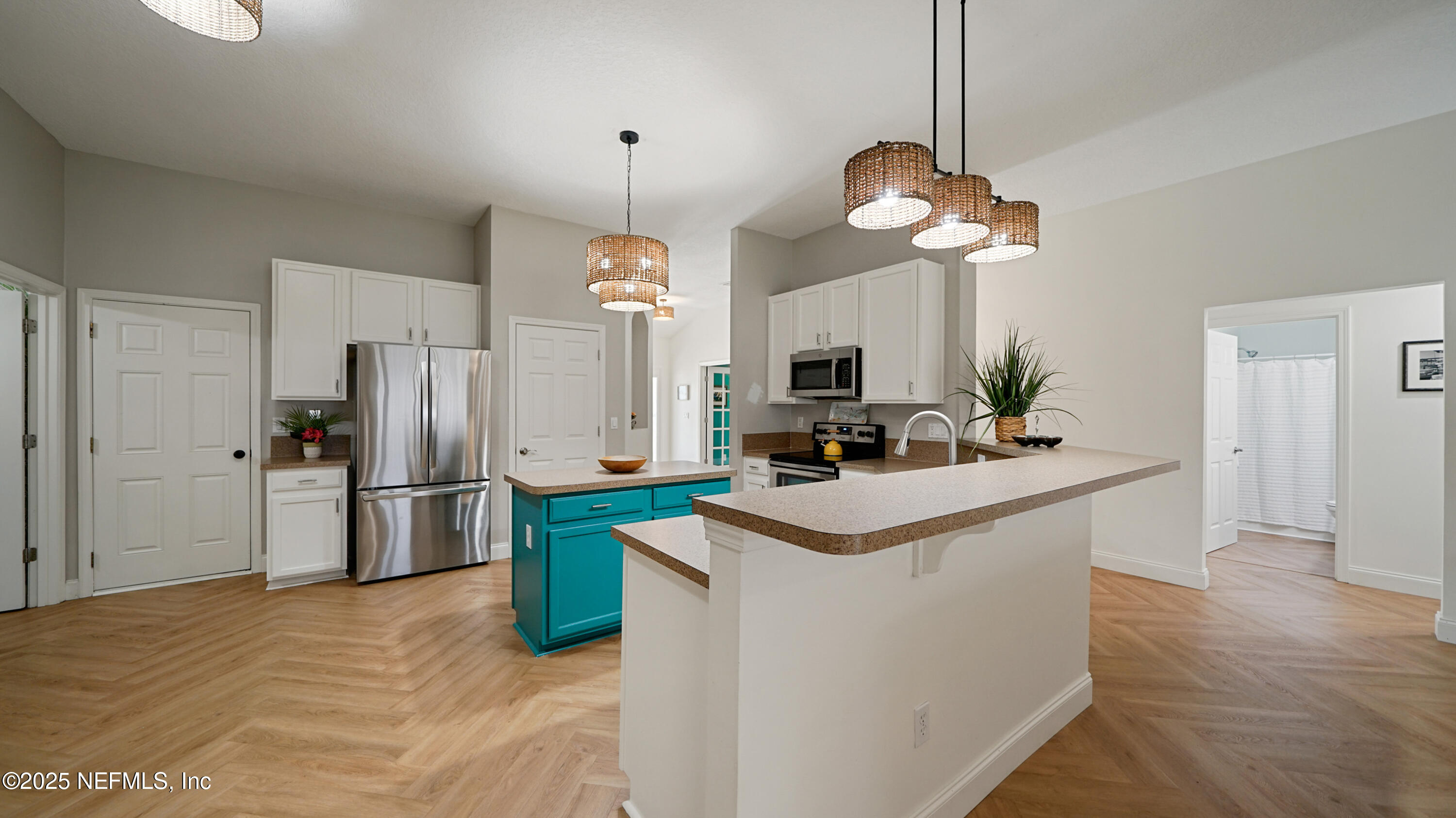 2020 Spring Meadows Court St. Augustine, FL 32092 - Photo 13 of 45 a kitchen with kitchen island a sink stove and refrigerator