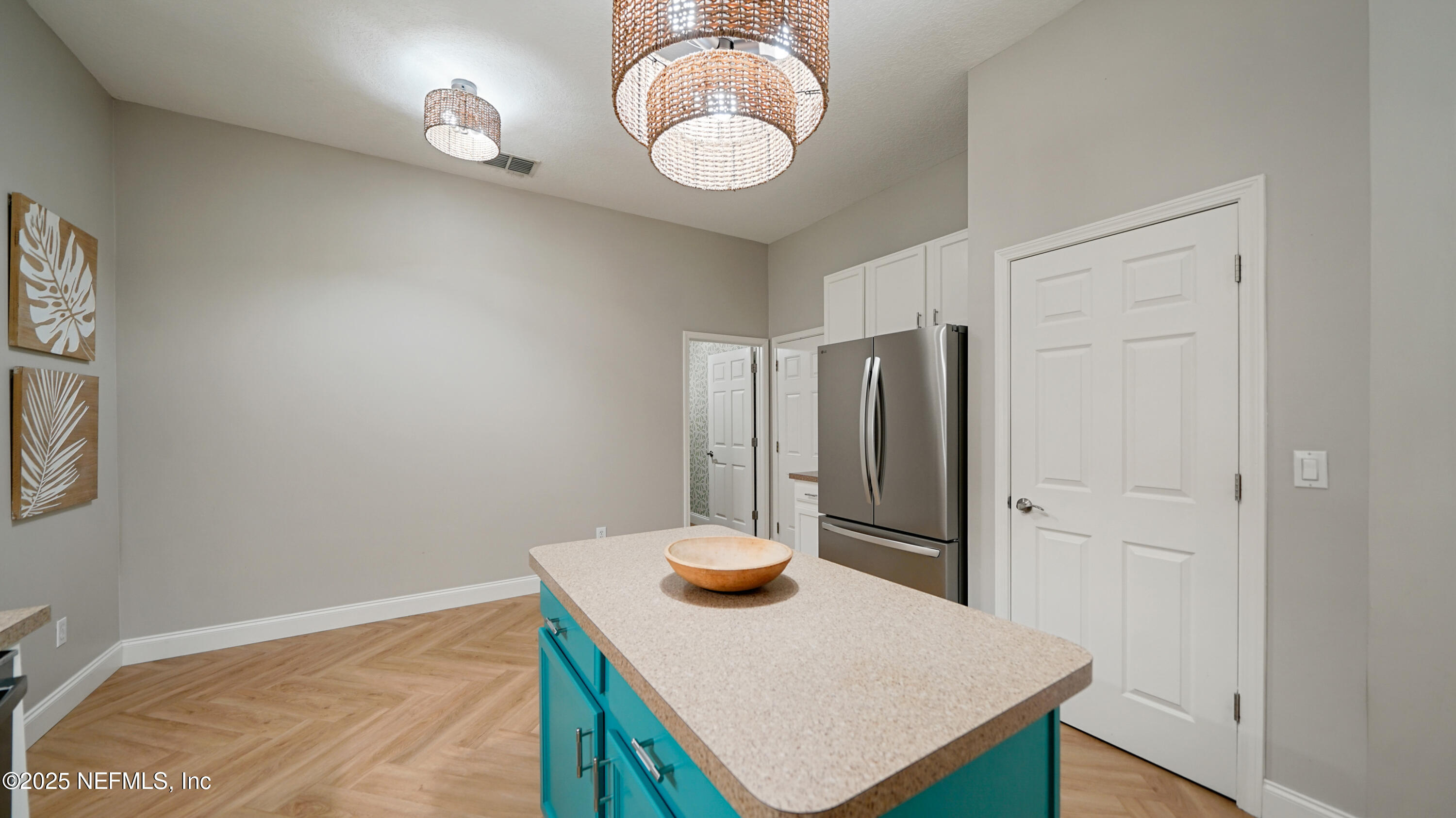 2020 Spring Meadows Court St. Augustine, FL 32092 - Photo 14 of 45 a kitchen with stainless steel appliances granite countertop a sink a refrigerator and a wooden cabinets