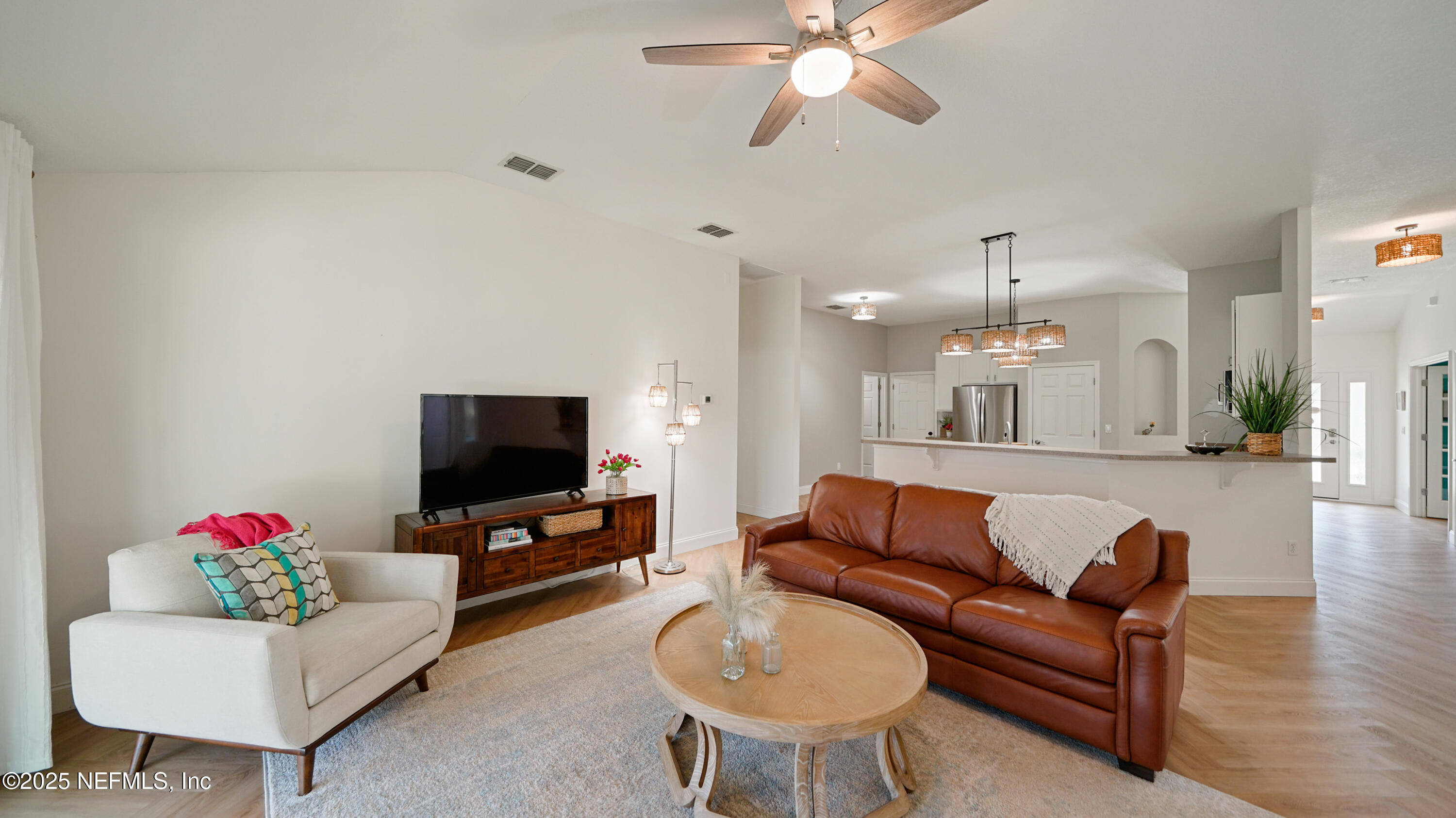 2020 Spring Meadows Court St. Augustine, FL 32092 - Photo 18 of 45 a living room with furniture and a flat screen tv