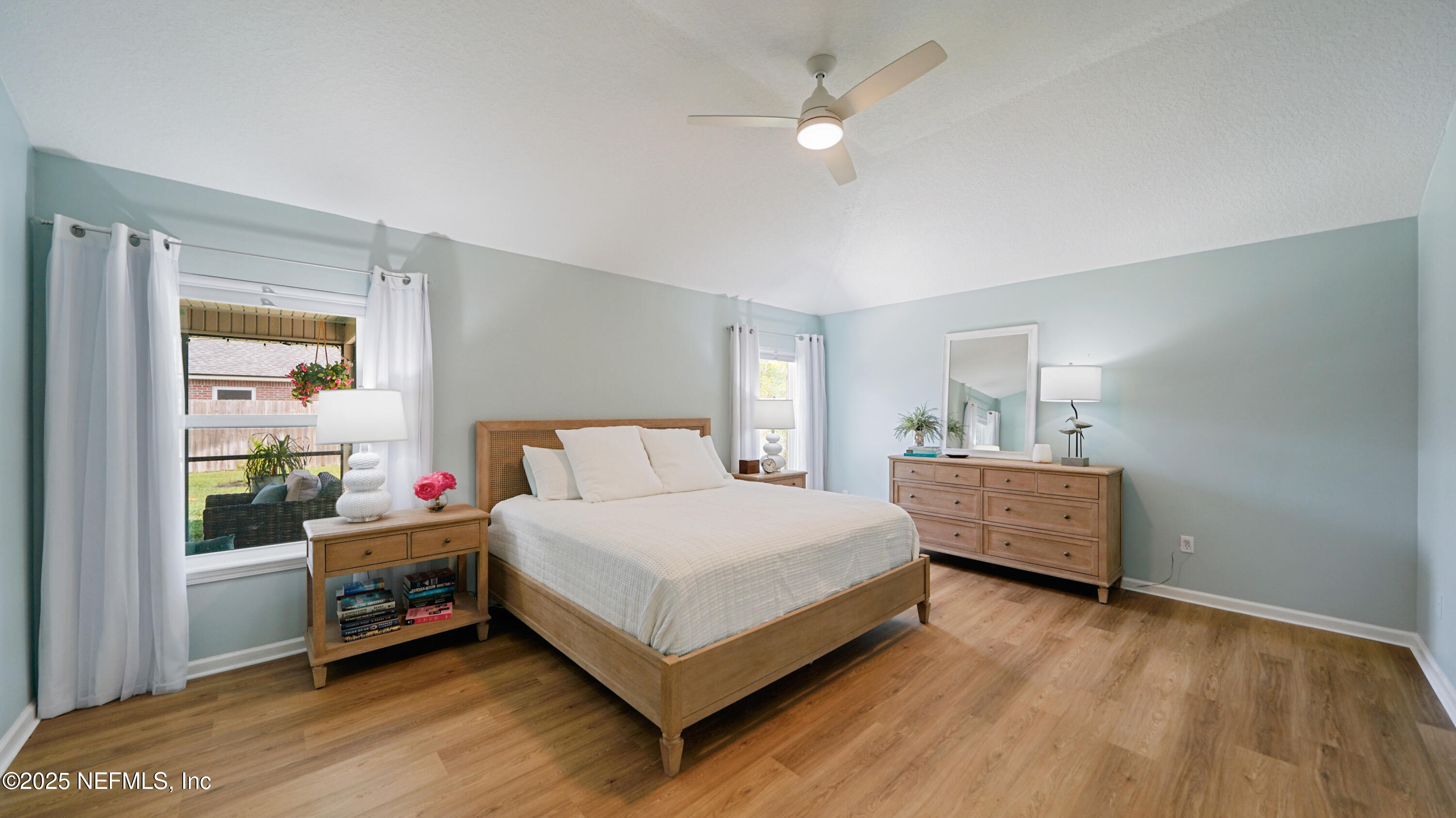 2020 Spring Meadows Court St. Augustine, FL 32092 - Photo 19 of 45 a bedroom with a bed and a window
