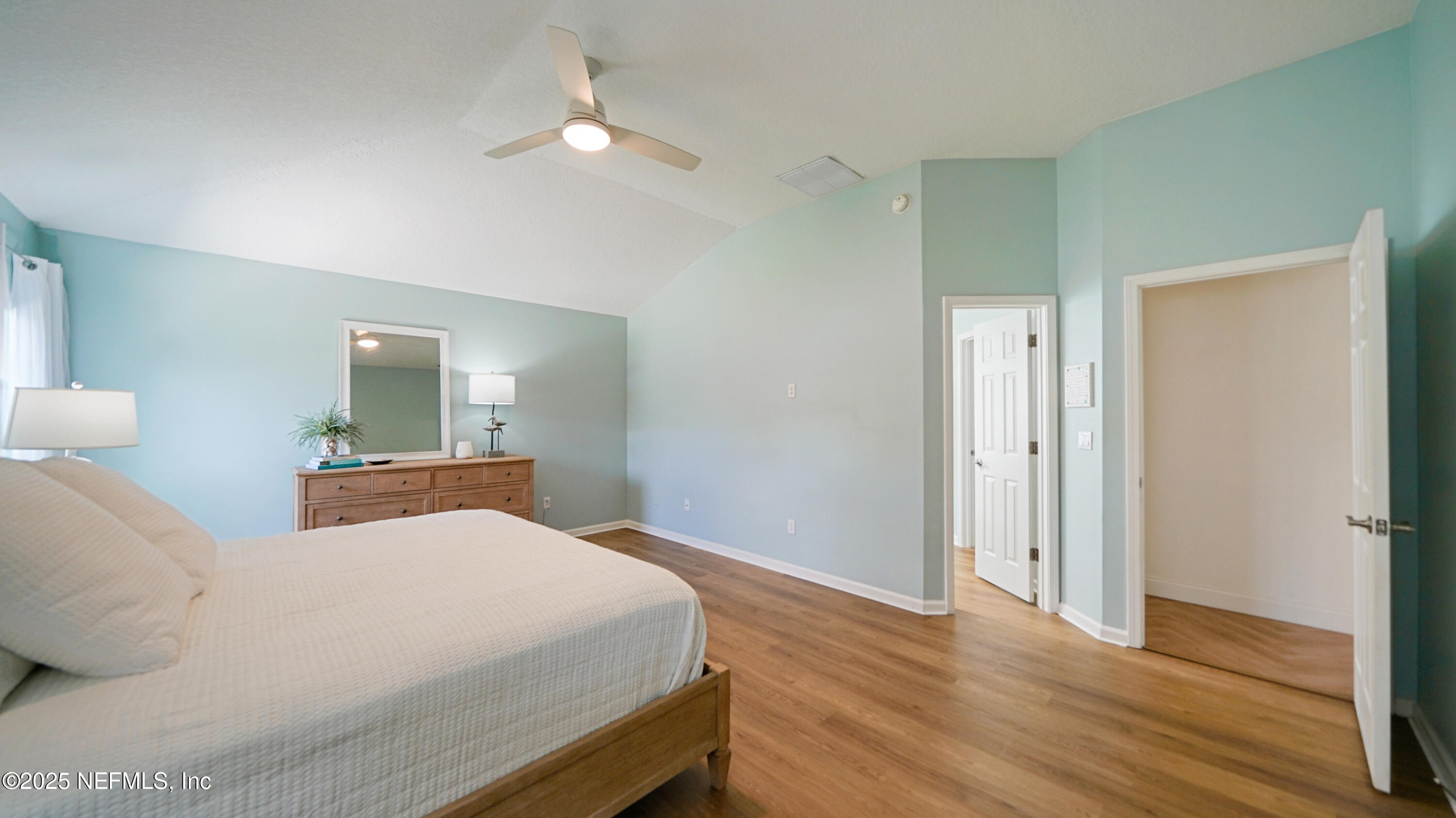 2020 Spring Meadows Court St. Augustine, FL 32092 - Photo 20 of 45 a bedroom with a bed and wooden floor