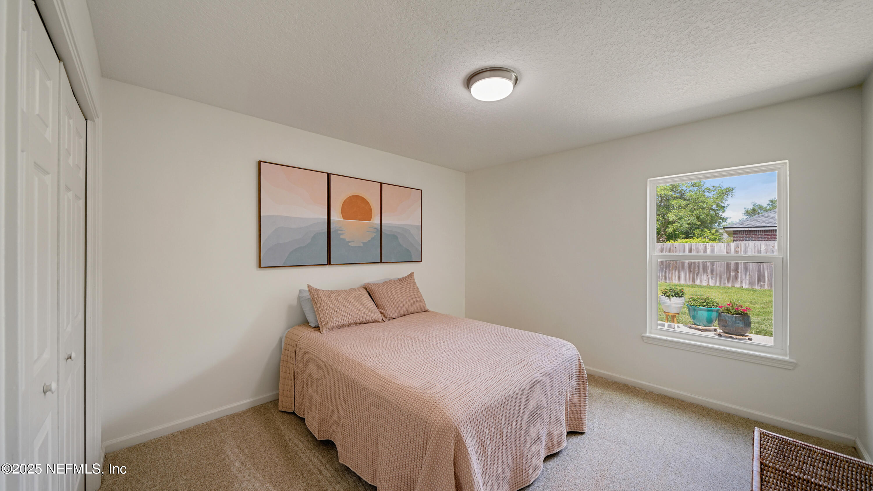 2020 Spring Meadows Court St. Augustine, FL 32092 - Photo 25 of 45 a bedroom with a bed and a window