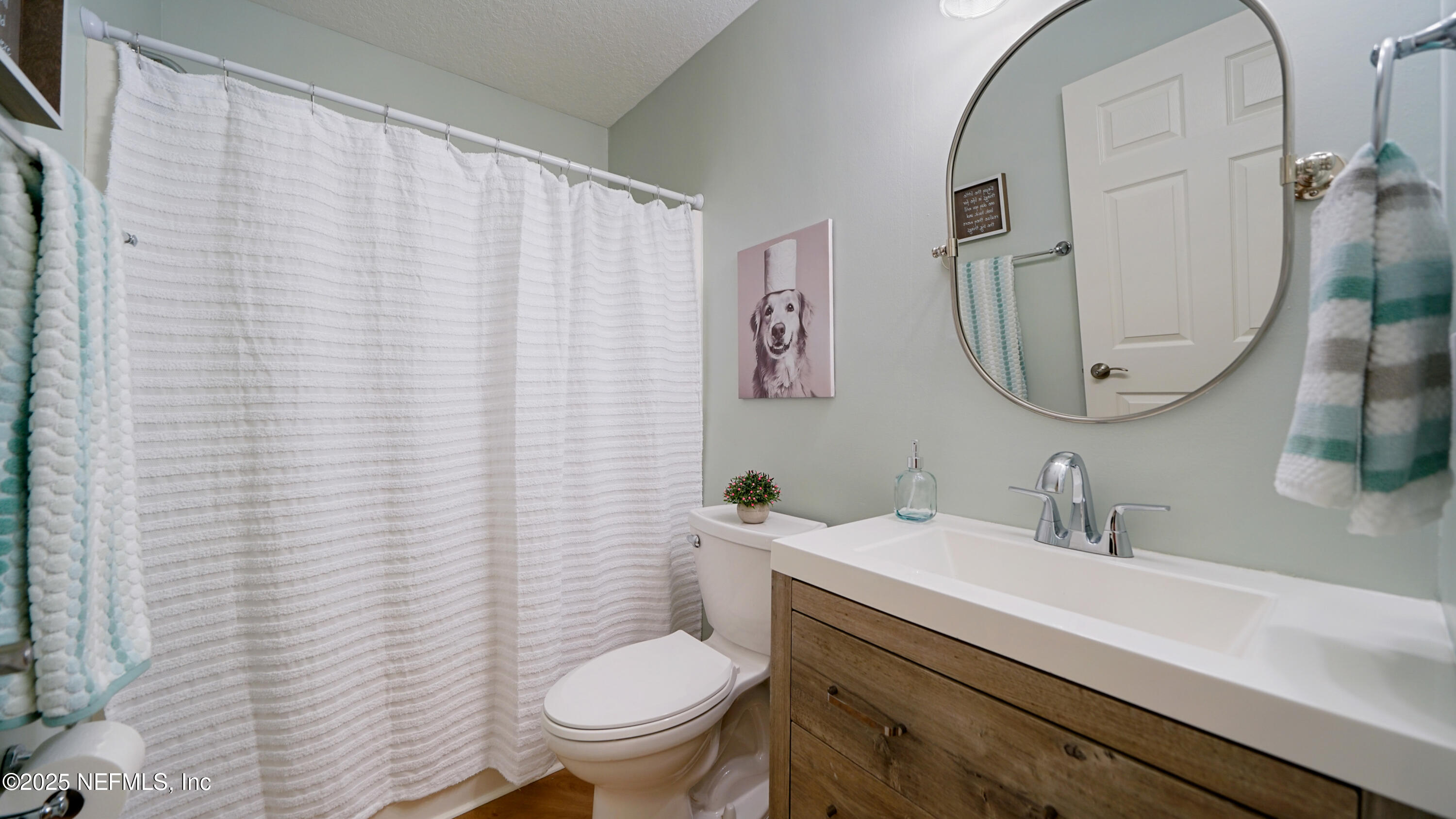 2020 Spring Meadows Court St. Augustine, FL 32092 - Photo 26 of 45 a bathroom with a granite countertop toilet sink and mirror