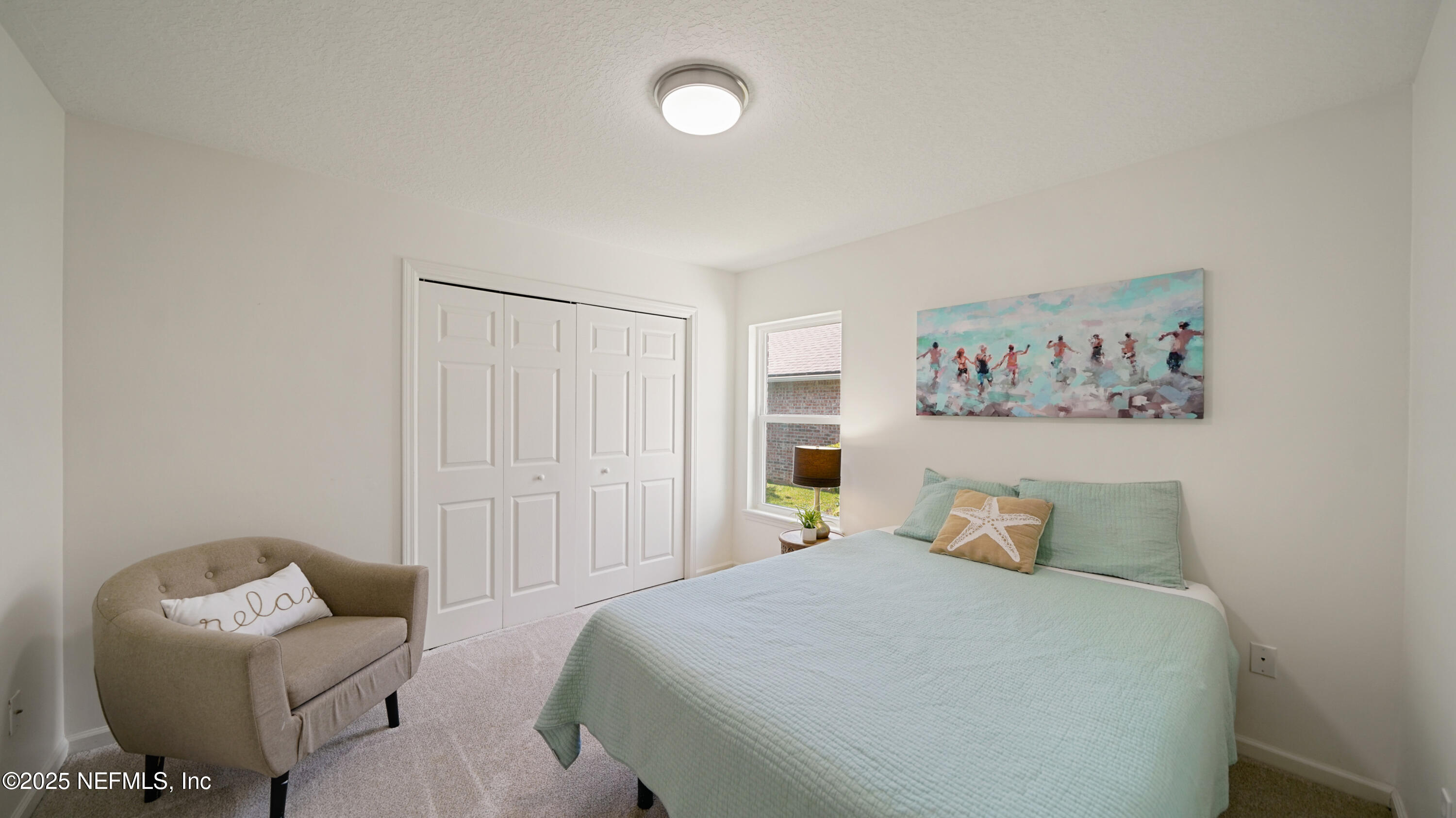 2020 Spring Meadows Court St. Augustine, FL 32092 - Photo 27 of 45 a bedroom with a bed and couch