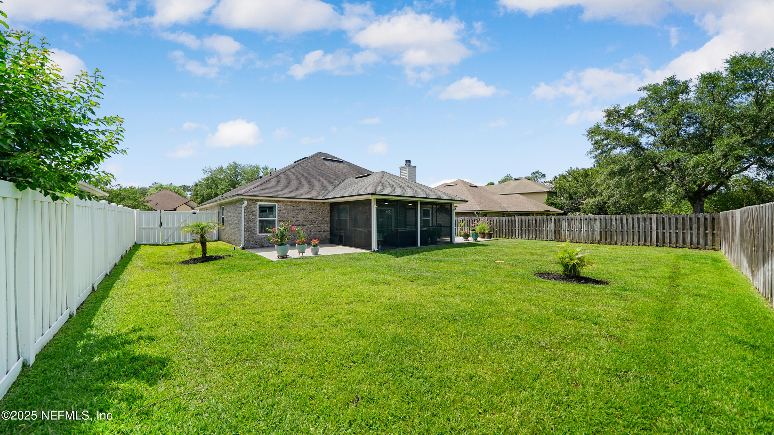 2020 Spring Meadows Court St. Augustine, FL 32092 - Photo 33 of 45 a front view of a house with a garden