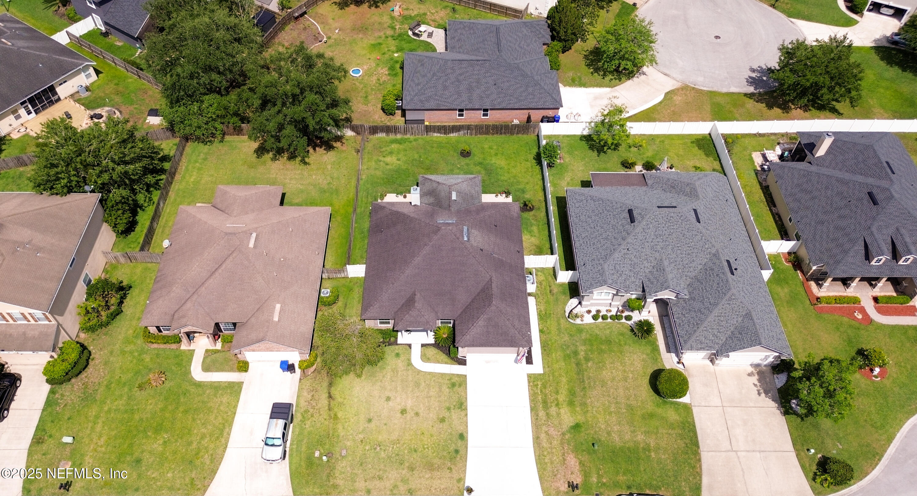 2020 Spring Meadows Court St. Augustine, FL 32092 - Photo 35 of 45 an aerial view of multiple houses with yard