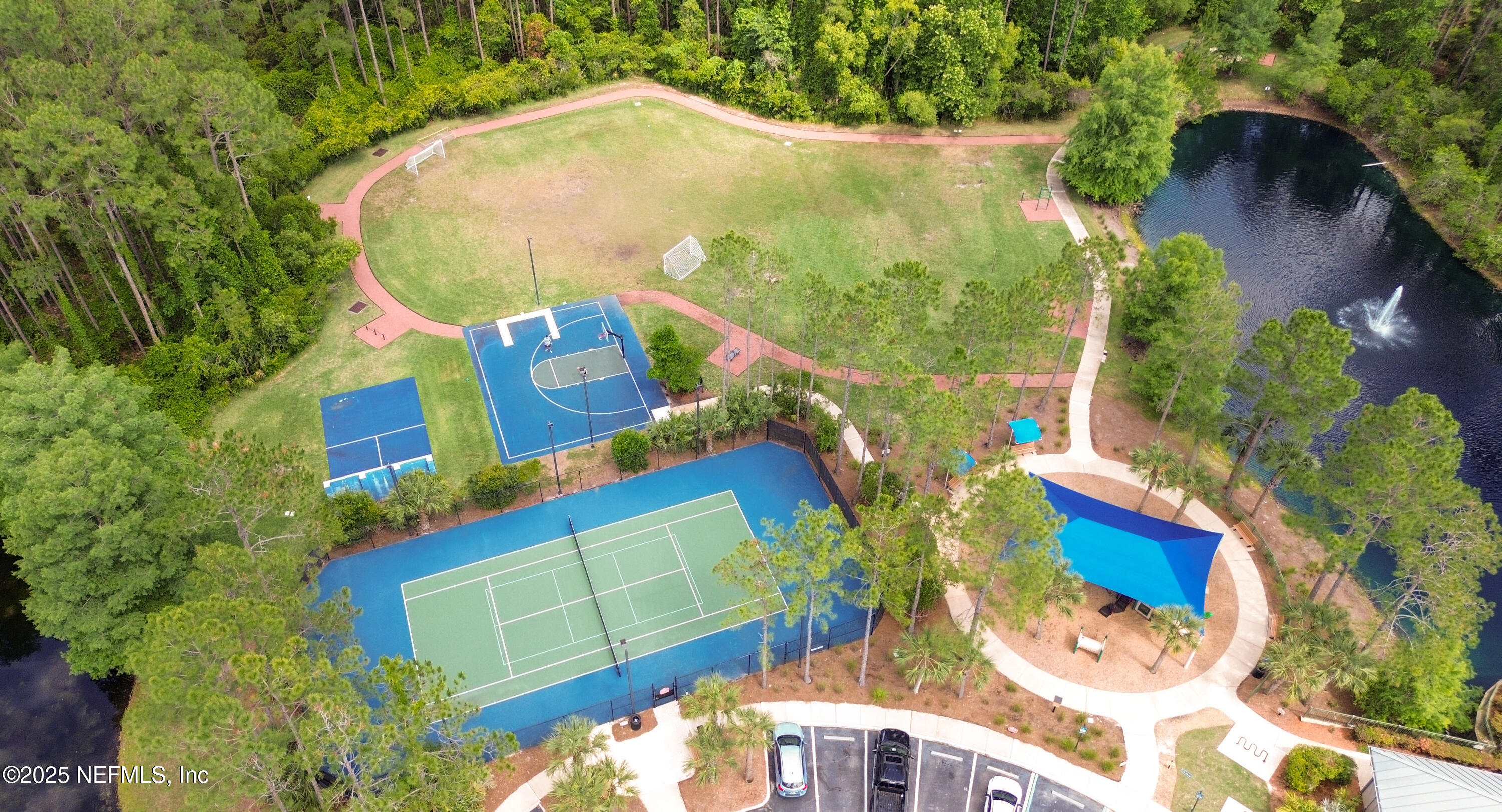 2020 Spring Meadows Court St. Augustine, FL 32092 - Photo 39 of 45 an aerial view of a house a yard and a fountain