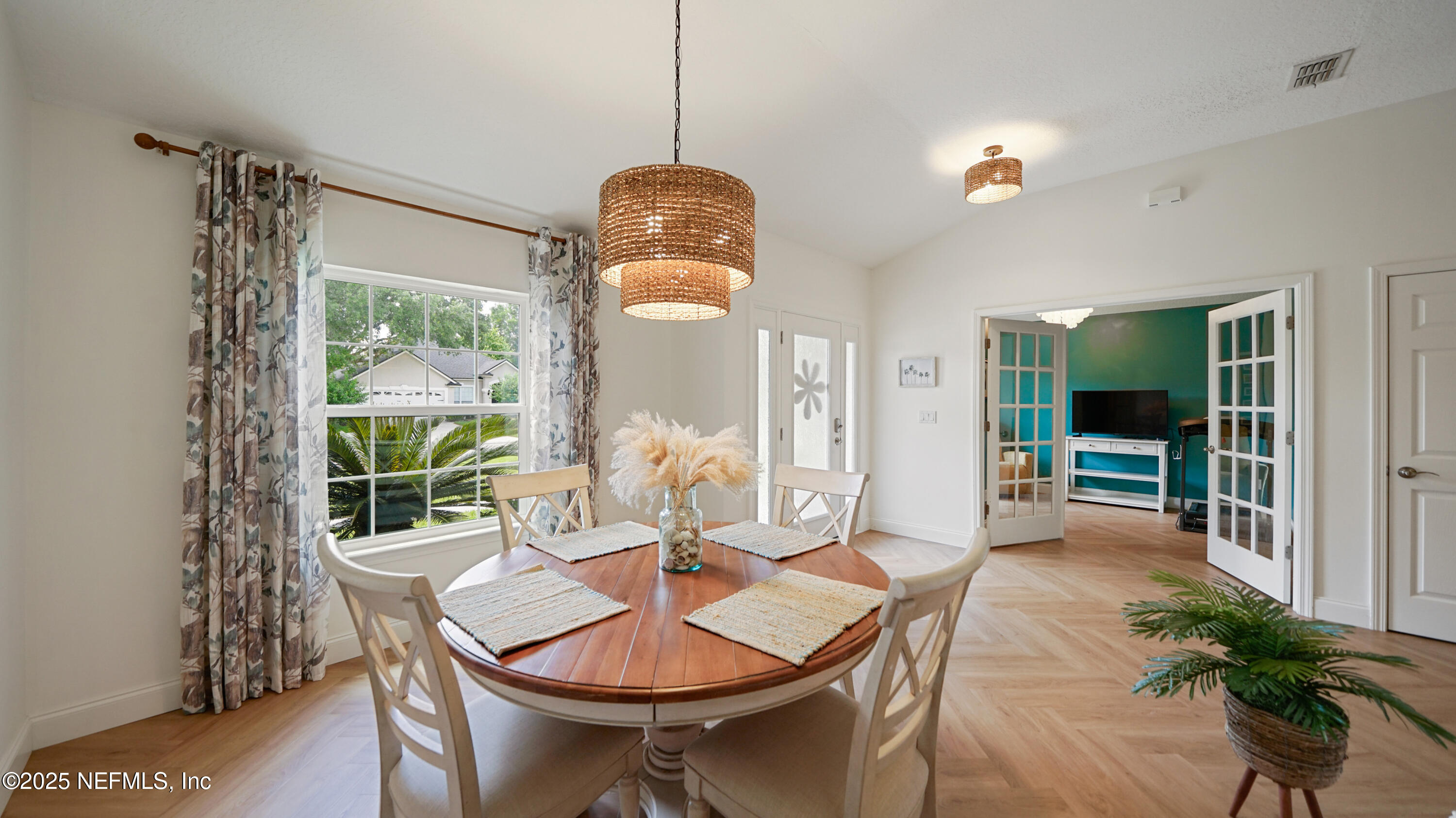 2020 Spring Meadows Court St. Augustine, FL 32092 - Photo 4 of 45 a view of a dining room with furniture window and wooden floor