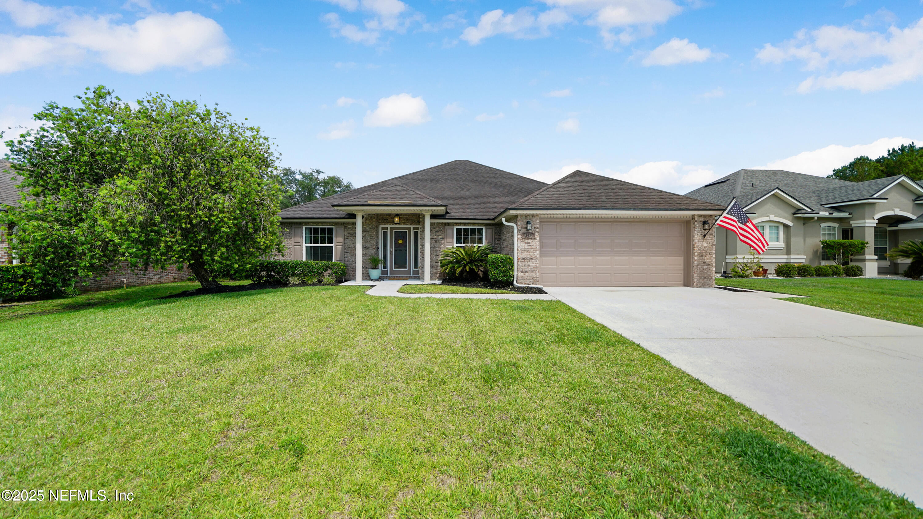 2020 Spring Meadows Court St. Augustine, FL 32092 - Photo 44 of 45 a front view of house with yard and green space