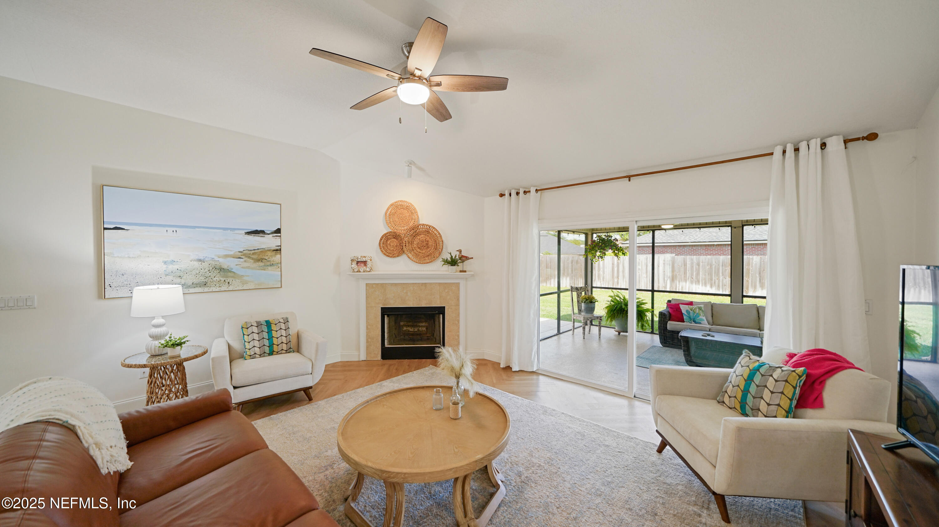 2020 Spring Meadows Court St. Augustine, FL 32092 - Photo 8 of 45 a living room with furniture a fireplace and a chandelier