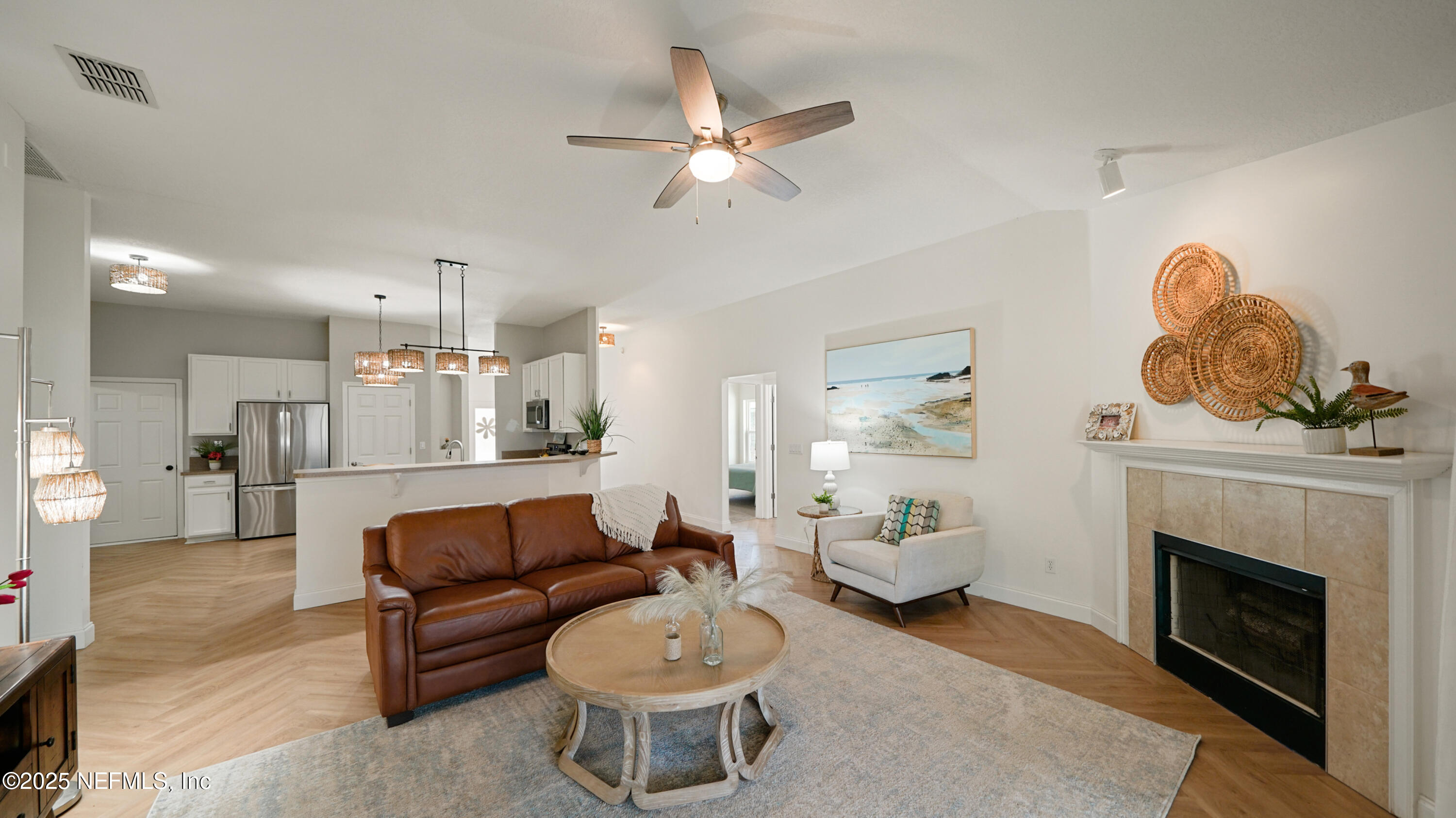 2020 Spring Meadows Court St. Augustine, FL 32092 - Photo 9 of 45 a living room with furniture and a fireplace