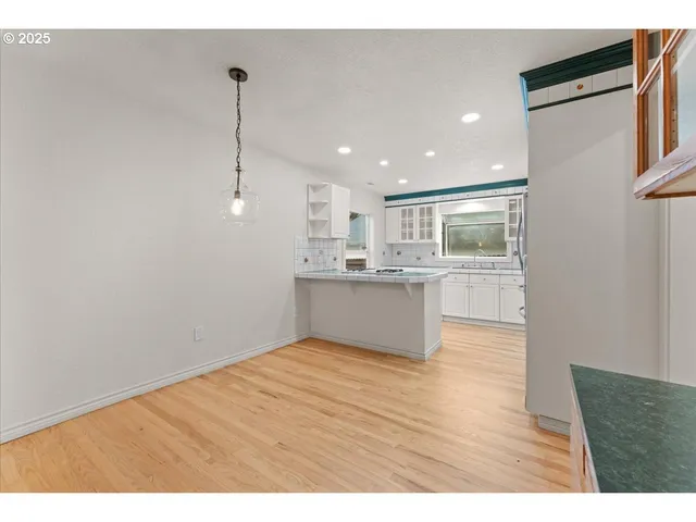 a view of kitchen with wooden floor