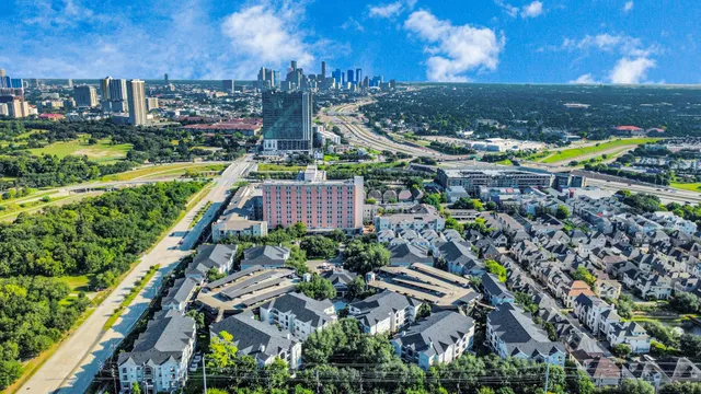 a kitchen with stainless steel appliances granite countertop a sink dishwasher stove and oven with wooden floor
