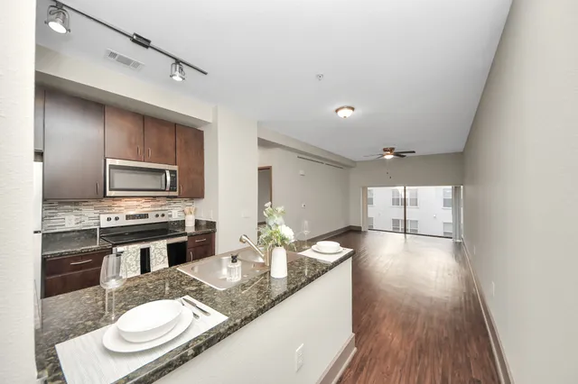 a kitchen with sink and view