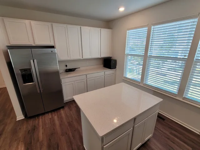 a kitchen with sink a microwave and stove
