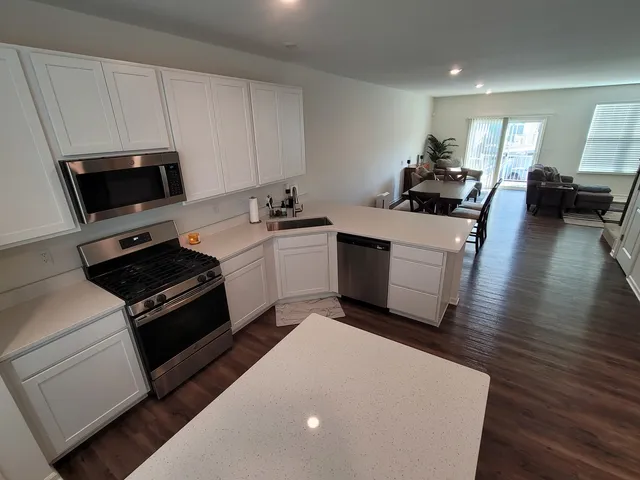 a view of living room with furniture and windows