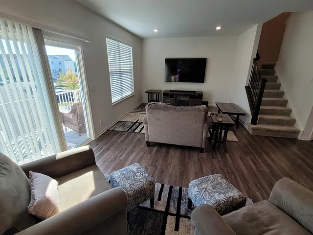 a view of a chair and tables in the balcony