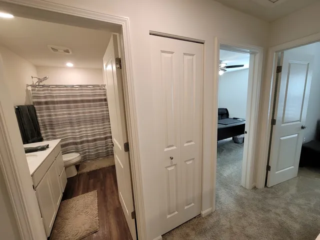 a bathroom with a sink a vanity and shower