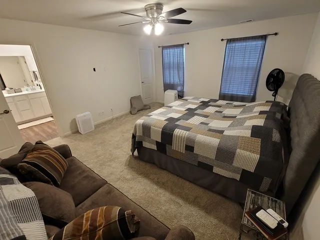 a bathroom with a tub and a shower