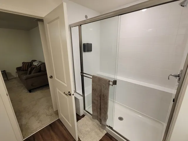 a bathroom with a double vanity sink and mirror