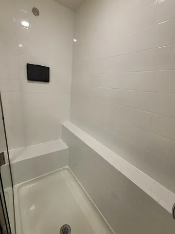 a bathroom with a double vanity sink and a mirror