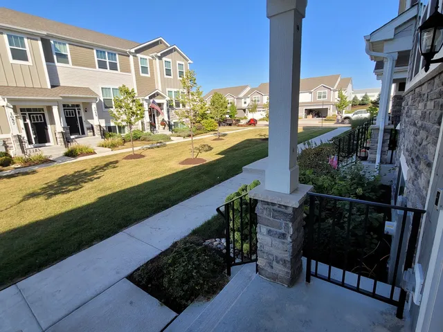 a view of a pathway with a house in the background