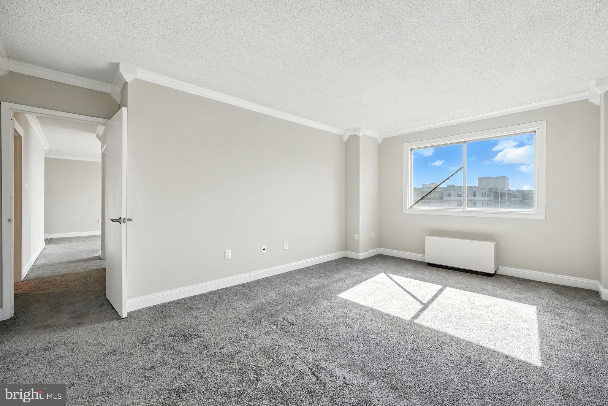 2059 Huntington Avenue, Unit 907 Alexandria, VA 22303 - Photo 15 of 21 a living room with furniture and a window