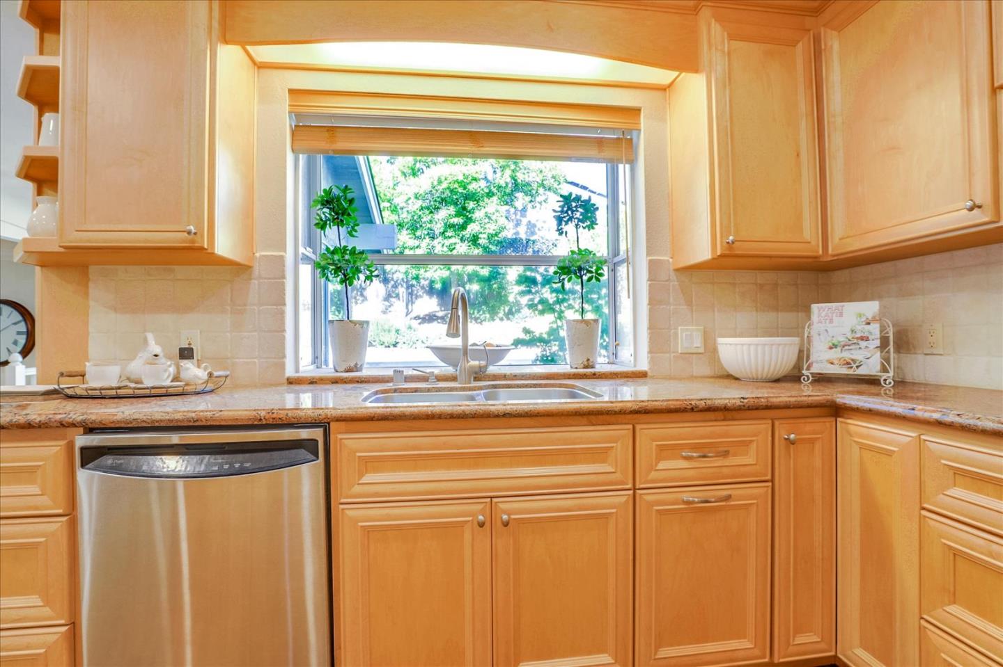 1262 Chateau Drive San Jose, CA 95120 - Photo 17 of 57 a kitchen with stainless steel appliances granite countertop white cabinets and a window